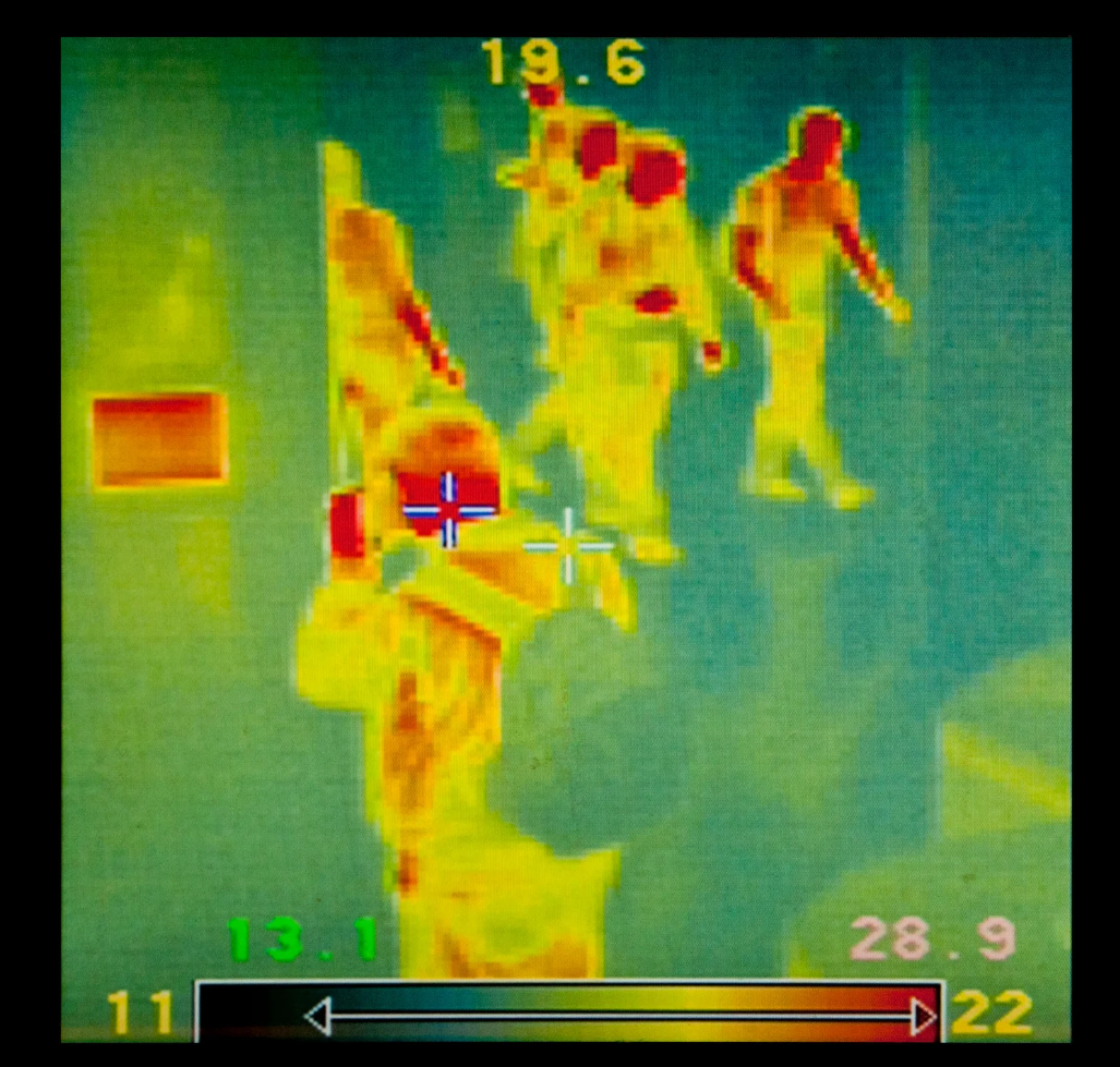 thermal-goggle-vision Thermal imaging showing people in red