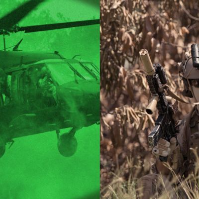 A soldier using infrared lighting to spot helicopter