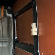 Vehicle work light with mounting bracket in the back of a bus