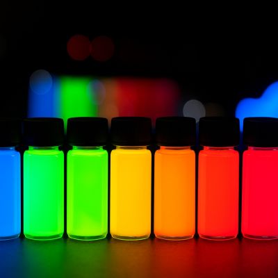 quantum dot and nanophosphor colored bottles